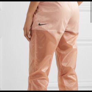 Nike shell track pants and crop top set. Good condition.